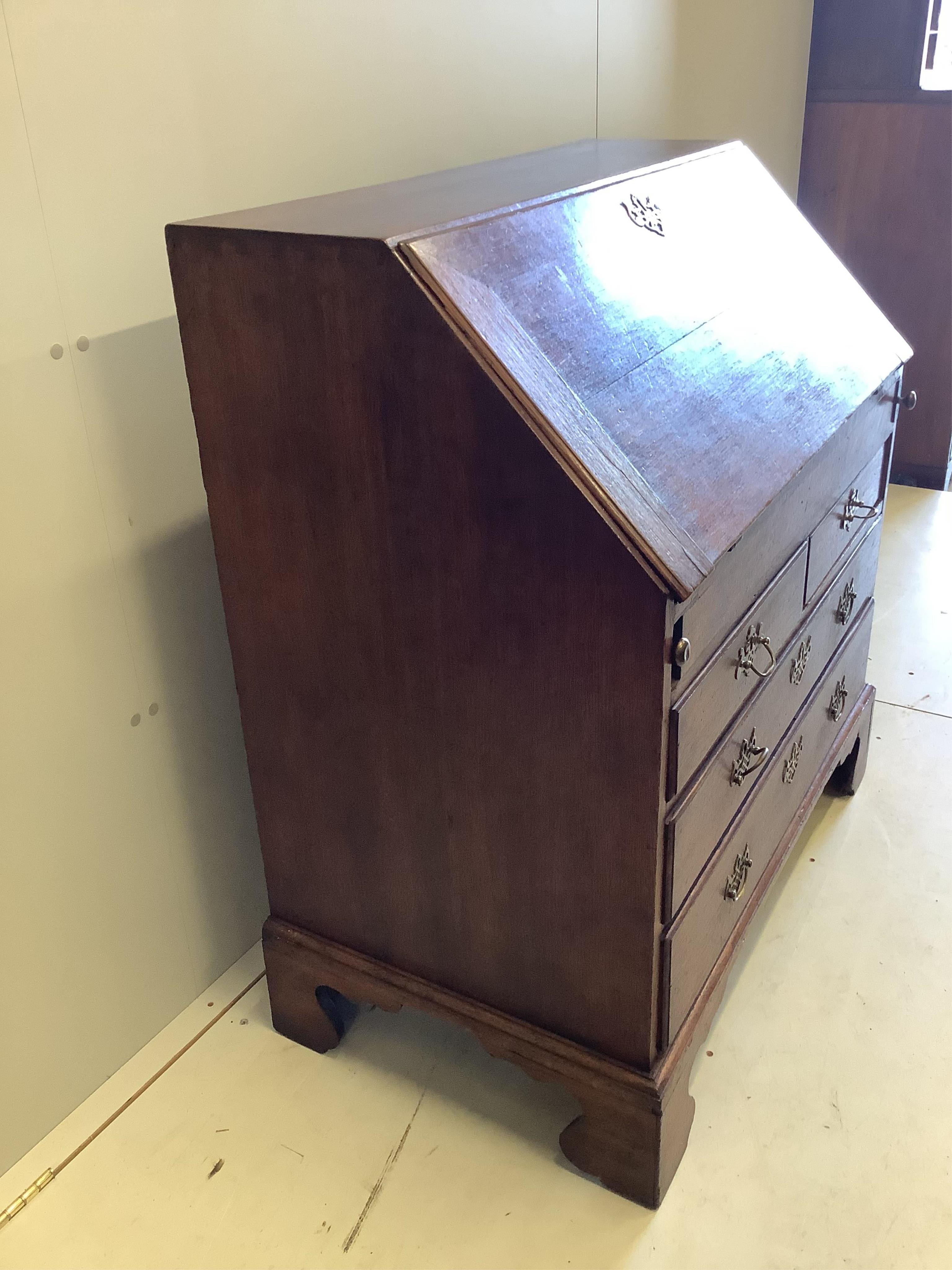 A mid 18th century oak bureau, width 94cm, depth 53cm, height 101cm. Condition - fair